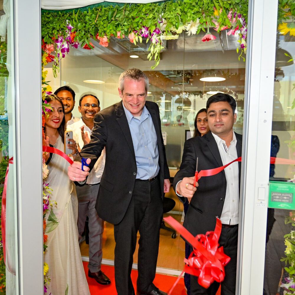 Todd Earls, CIO, and Nagendra Singh, Director & Center Head, cut the red ribbon during the opening ceremony.